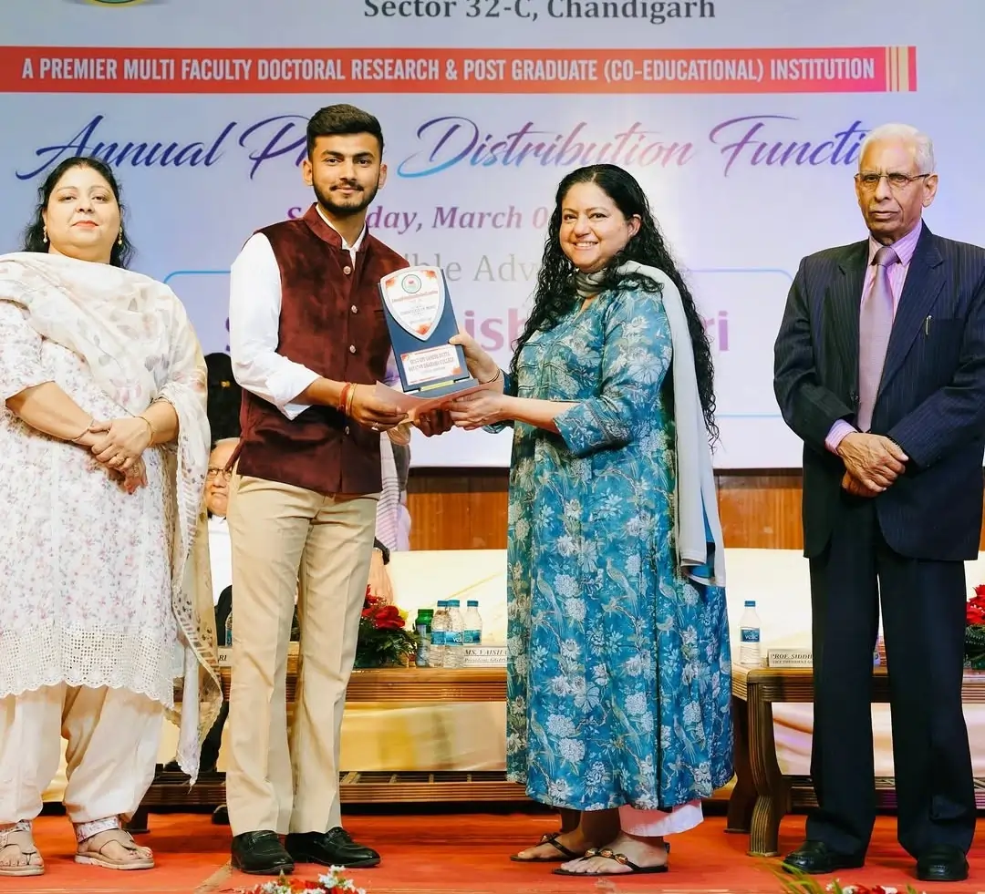 Harsh getting an award from college principal